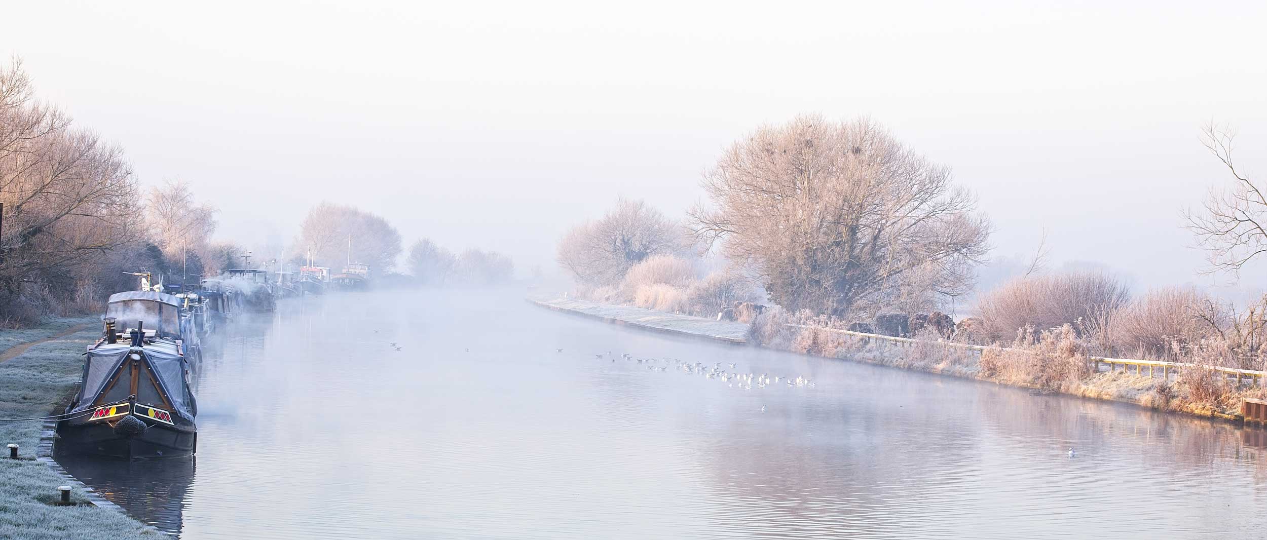 The Gloucester and Sharpness Canal on a cold winter’s morning, from Patch Bridge, Gloucestershire, England, UK.