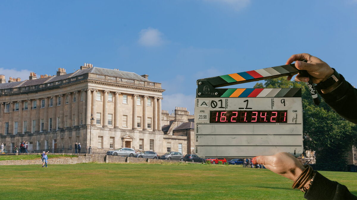 No. 1 Royal Crescent, a grand, crescent-shaped row of Georgian townhouses in Bath and a cut out of a clap board used in filming productions.