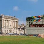 No. 1 Royal Crescent, a grand, crescent-shaped row of Georgian townhouses in Bath and a cut out of a clap board used in filming productions.