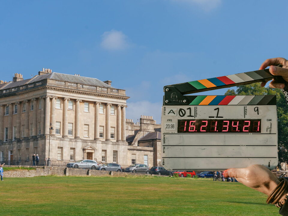 No. 1 Royal Crescent, a grand, crescent-shaped row of Georgian townhouses in Bath and a cut out of a clap board used in filming productions.